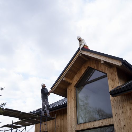 long-shot-men-working-roof-together